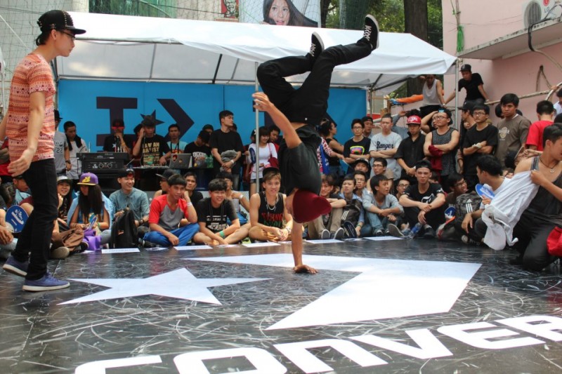 A HipHop (B-boy) dancer landing a freeze during the Converse Street Festival