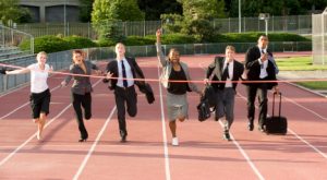 Business people cross the finish line
