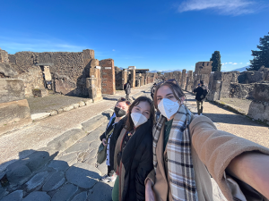 Cosette, Claudia and I in the middle of one of the main roads in Pompeii. It was on this road that our tour guide pointed out some symbols on the streets that helped lead travelers that did not speak Latin to the famous brothel.