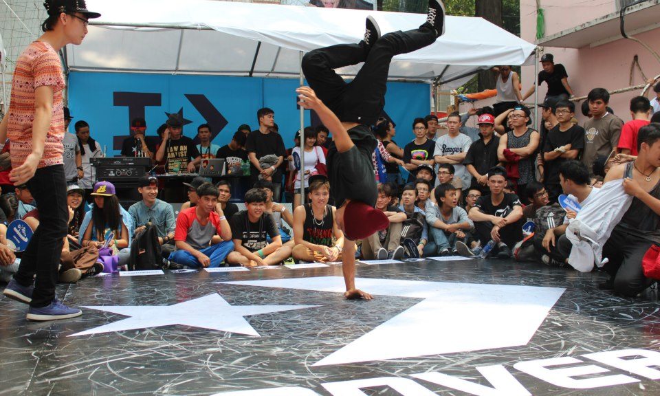 A HipHop (B-boy) dancer landing a freeze during the Converse Street Festival